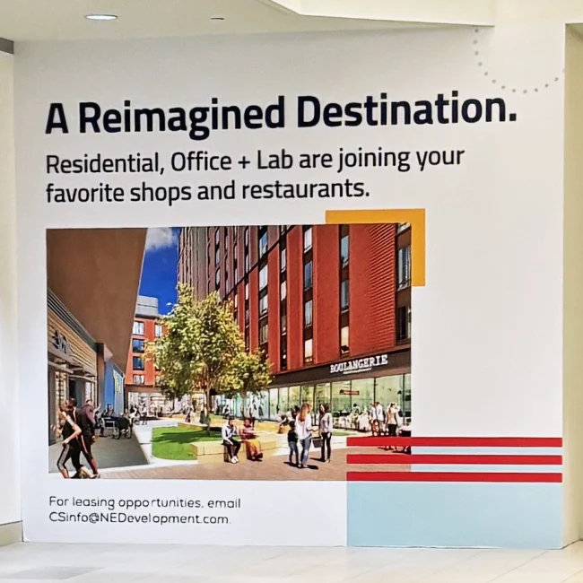 Final Print add for a New England Development posted in a shopping mall