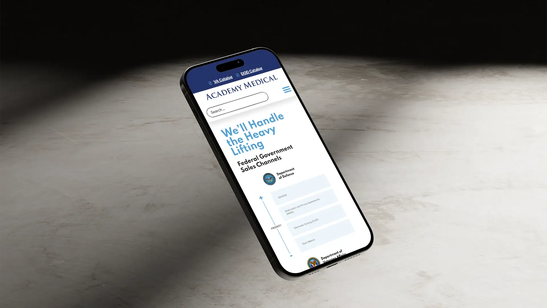 angled picture of a phone with academy medical webpage on it