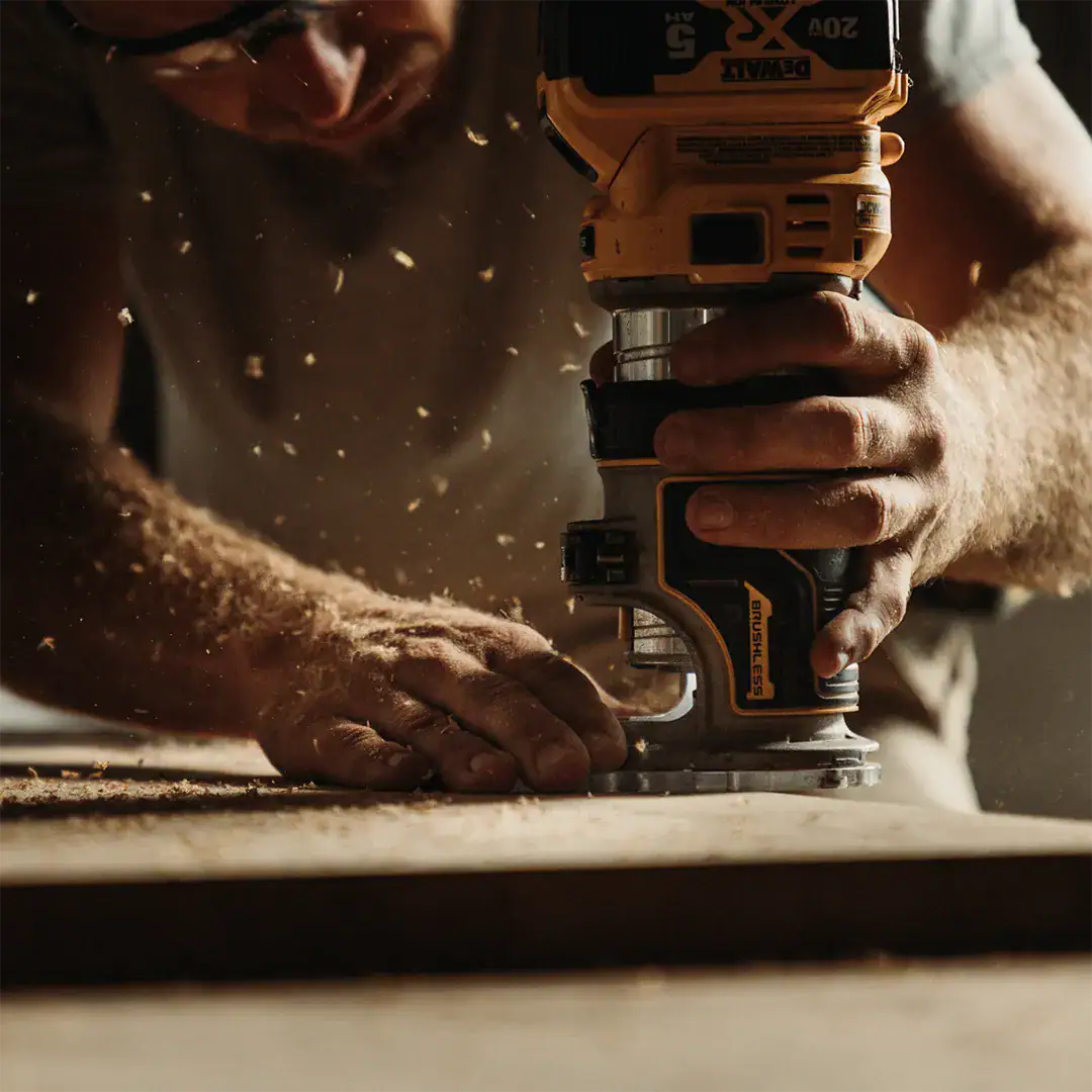 Man using power tools to shape wood