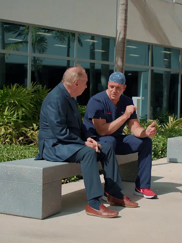 doctor and patient speaking outside of medical centre