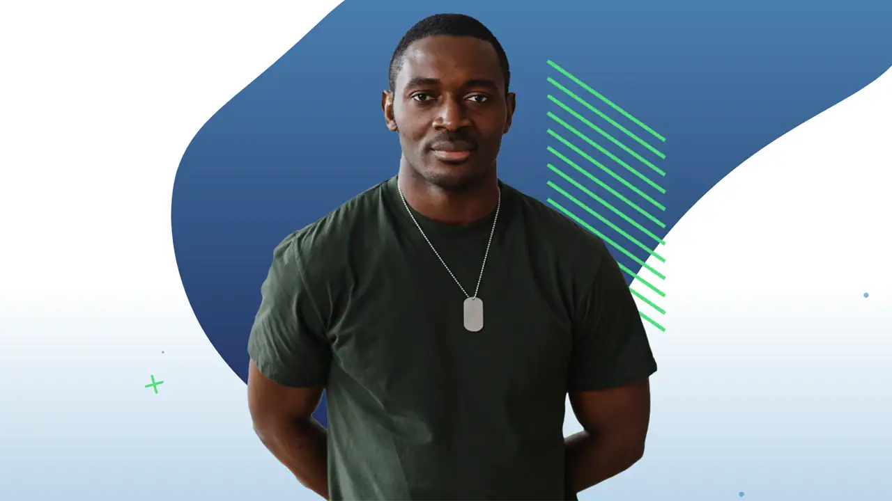 Man Wearing green shirt and a dog tag posing for a picture
