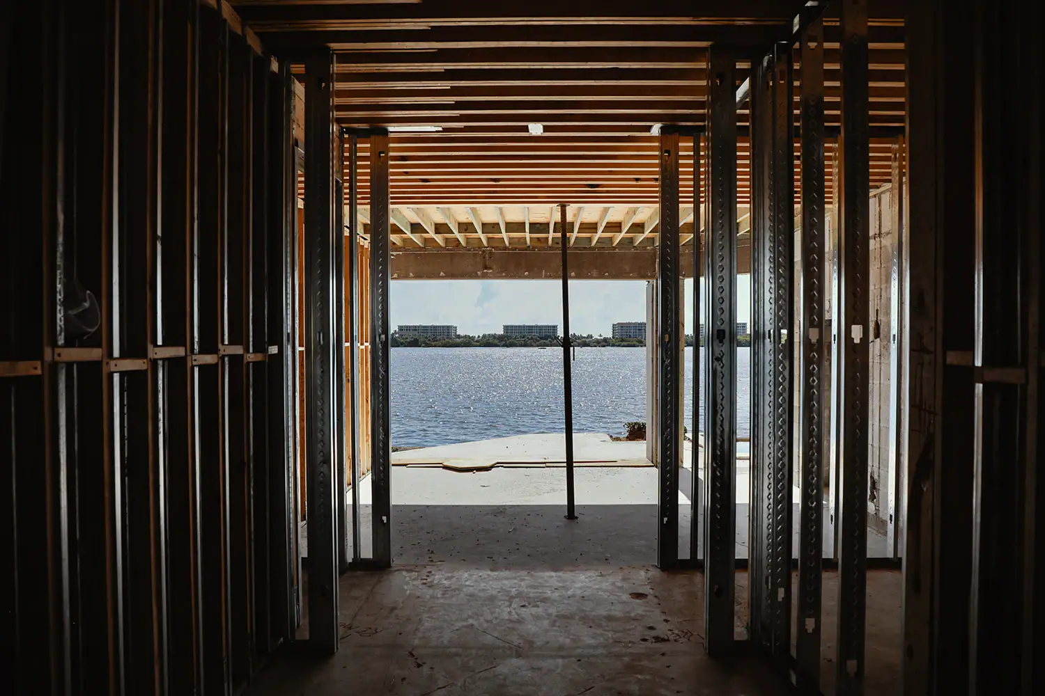 base frames of house while overlooking water