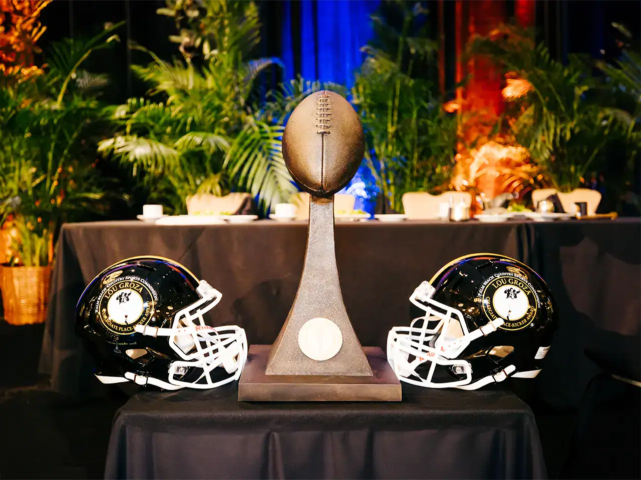 Lou Groza Award inbetween 2 helmets