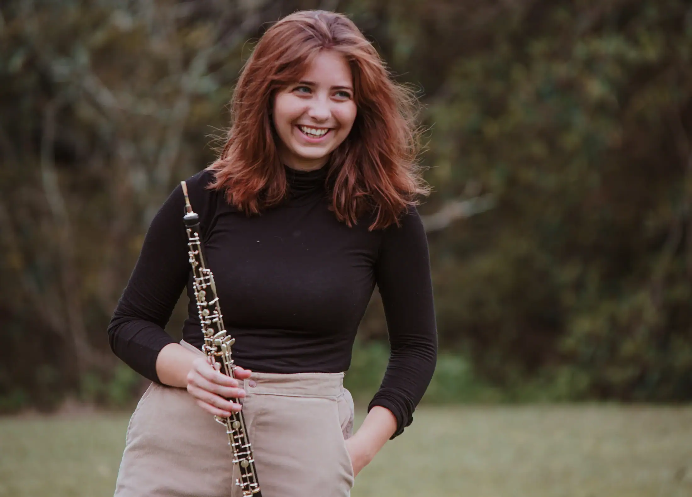 young girl holding clarinet