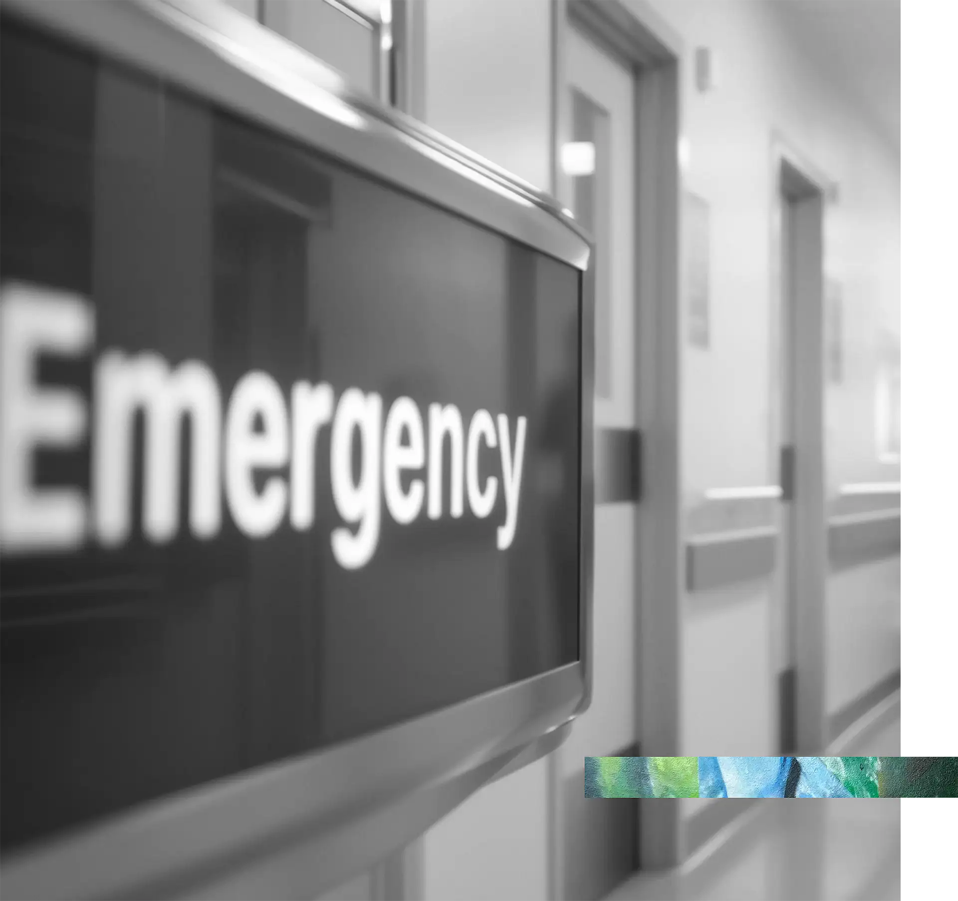 Emergency response sign in hospital corridor, black and white photo.