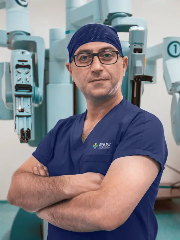 Robotic surgeon in scrubs with surgical robots in background.