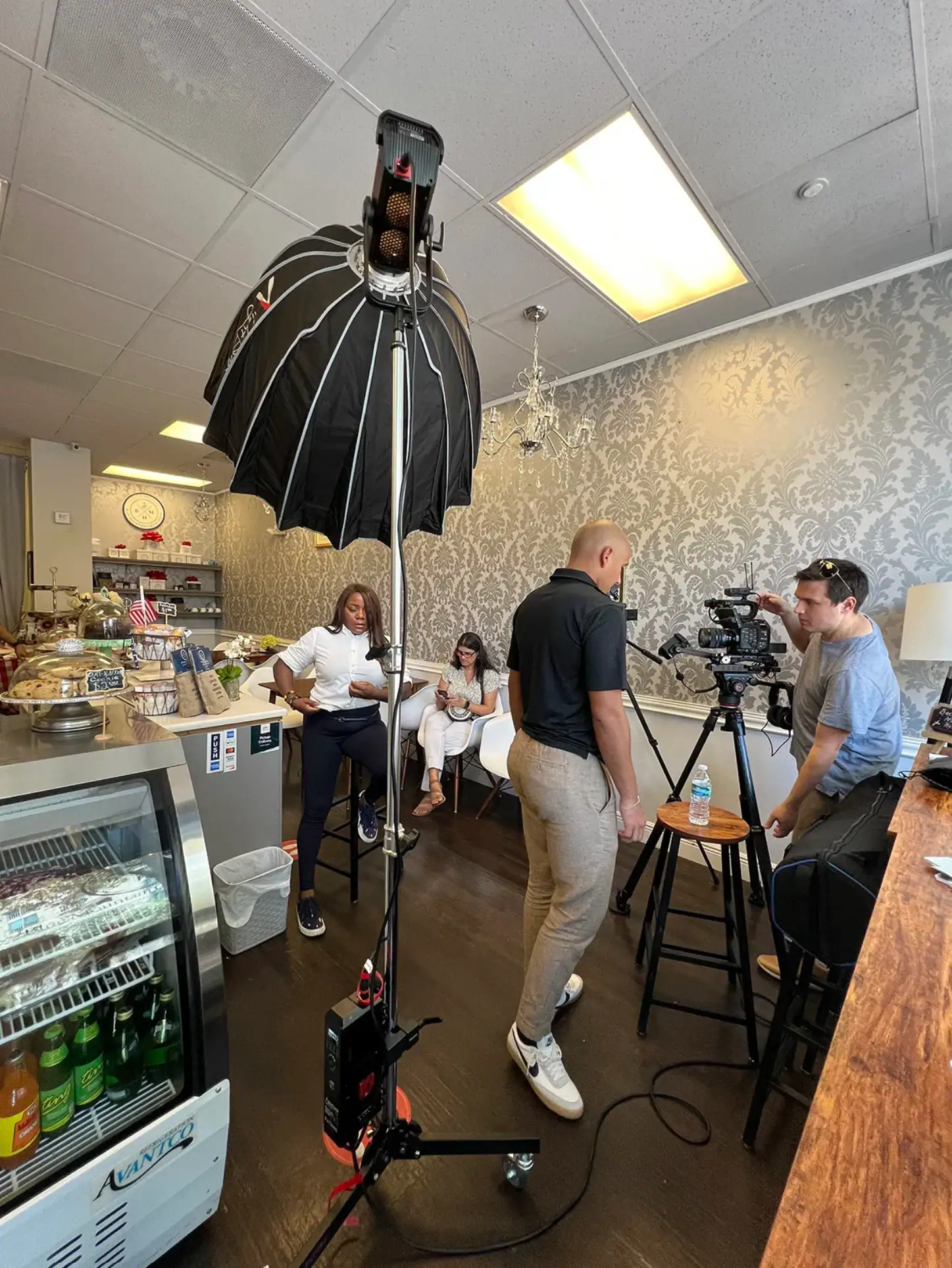 Alex and Shane setting up camera equipment to film session inside Blue Mountain Coffee House in West Palm Beach, FL.