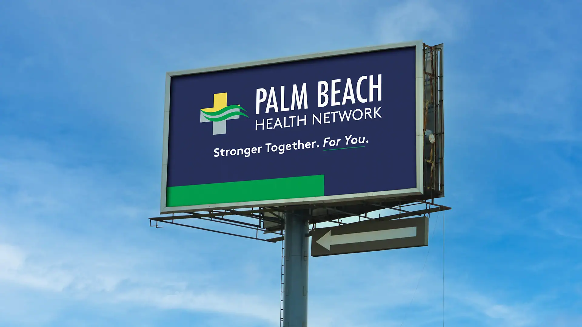 Billboard for Palm Beach Health Network highlighting healthcare services in Florida.